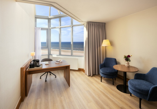 NH Zandvoort Rooms Superior Seaview Desk Coffee Machine Flowers Book Blue Chairs